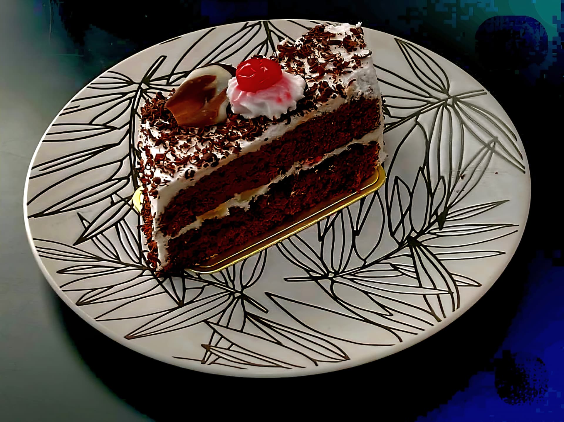 A Black Forest cake slice on a plate from the Bob One bakery